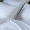 White Washed Cotton Percale Pillowcases (Pair) 1 White Washed Cotton Percale Pillowcases (Pair) -Piglet in Bed Store Piglet in Bed Washed Cotton Bedding White Lifestyle 5 f00a5c54 cf83 4be5 950b eeab762281bf