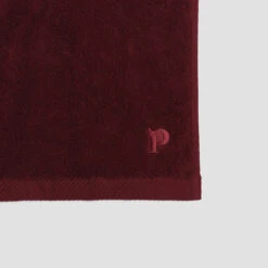 Merlot Organic Cotton Bath Towel -Piglet in Bed Store PigletinBed BathroomCollection OrganicCottonDetail Merlot 1 GreyBG 81f861ac 43e0 4e49 8f76 f3210656c444